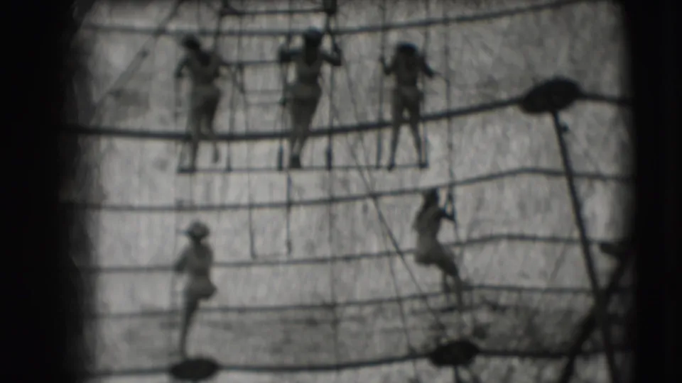 1948 8mm footage from the Sarasota Ringling Brothers metadata shows distant figures moving through ship-like rope rigging.