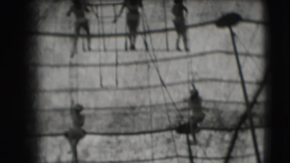 Distant figures appear on rope rigging in the 1948 Sarasota circus-related home-movie footage.