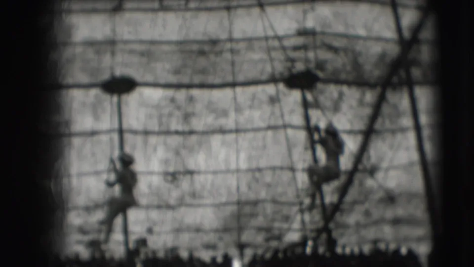 The final frame shows distant climbers among layered ropes and supports in 1948 8mm Sarasota Ringling Brothers footage.