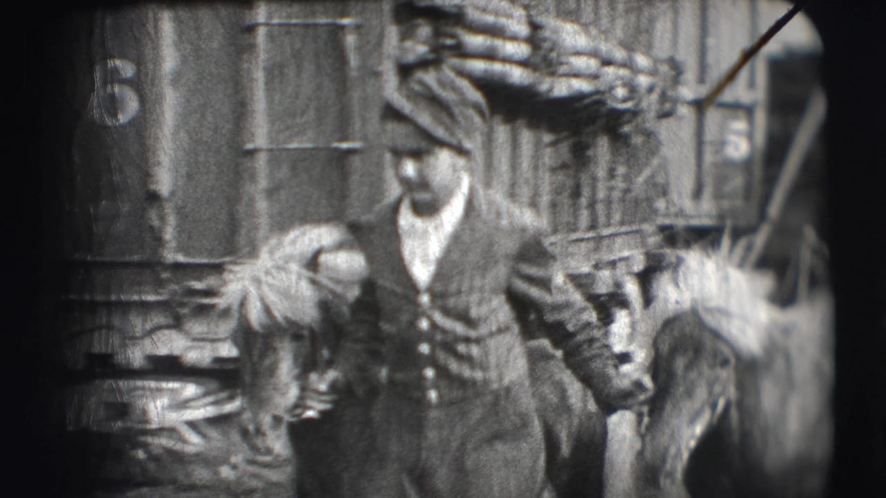Men near a circus structure, one in a uniform cap, with a horse partially visible at the side.