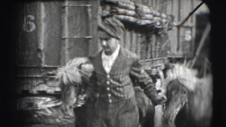 In the 1948 Ringling Brothers Sarasota footage, men stand or move near a circus structure, with a uniformed figure and a partial horse visible.
