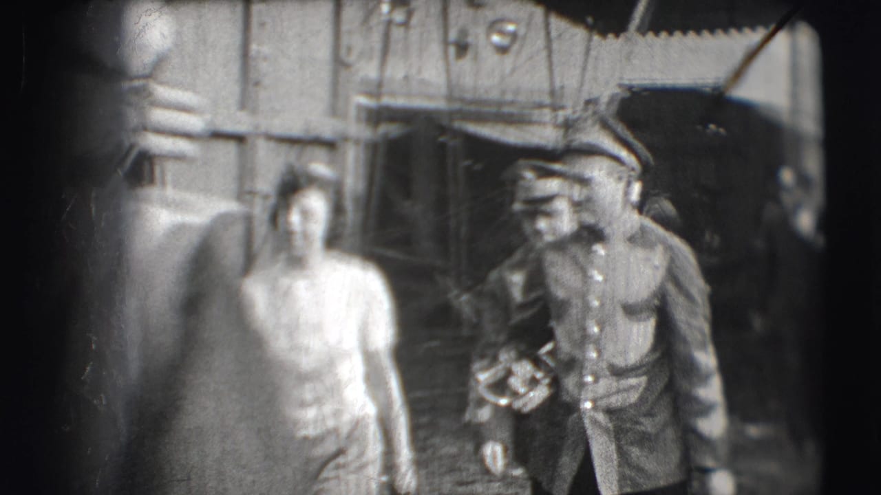 Uniformed circus musician carrying a brass instrument near a woman and a circus wagon.
