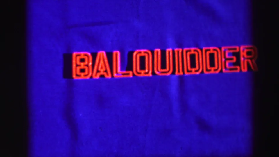 Balquidder title card holds in frame, with saturated blue background, red lettering, grain, and visible projection darkness.