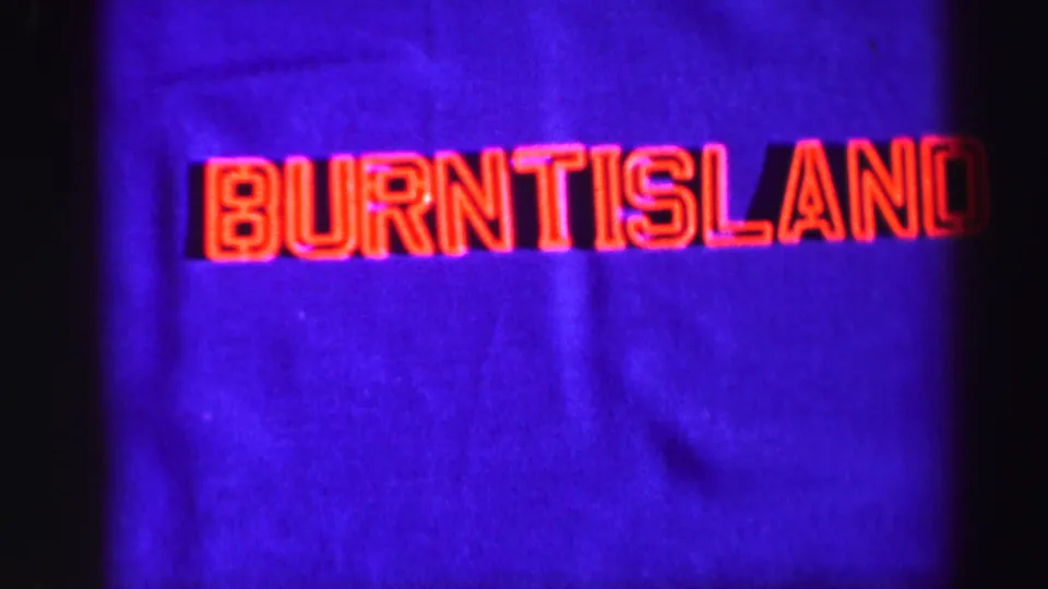 A home-movie title card reads Burntisland in red outlined letters against a deep blue field.