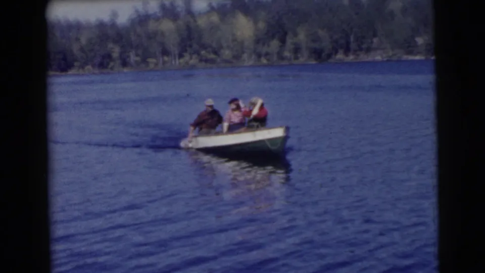 A 1956 Miami lake scene shows the rowboat closer in frame, with one adult rowing and two passengers seated beside them.