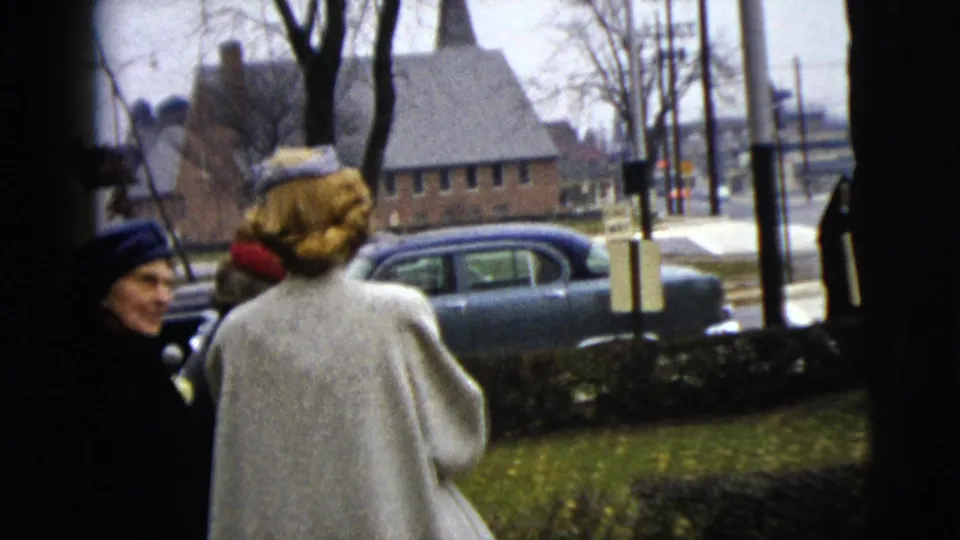The final 1962 Moline frame shows women in winter coats near a residential street, with a parked car, lawn, bare trees, and brick building visible.