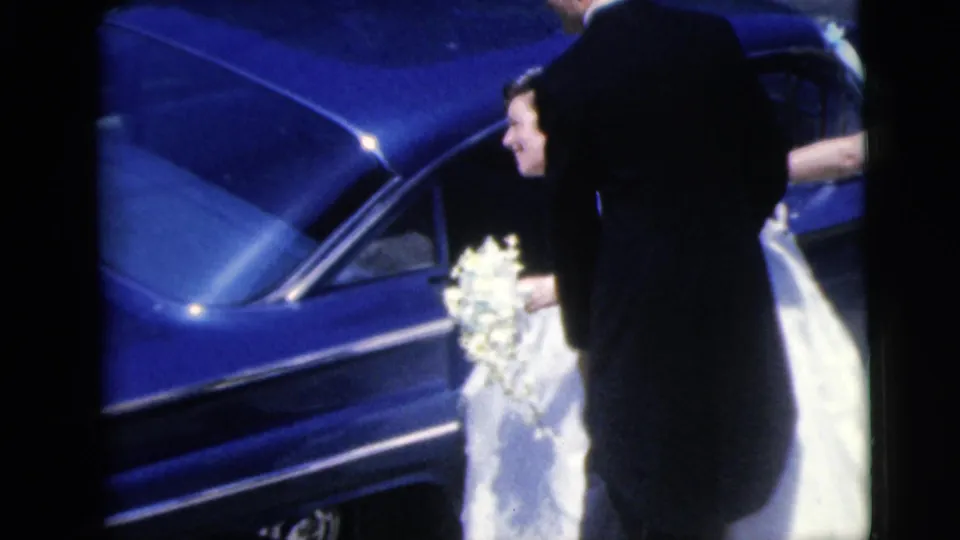 The final frame shows the bride and bouquet beside the blue car, with a dark-suited figure partly blocking the view.