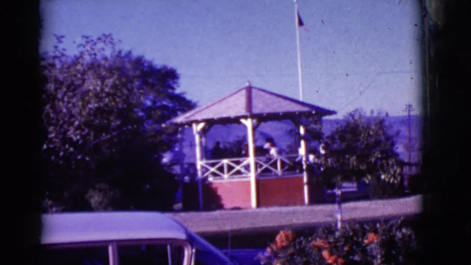 A brief 1966 Clarkdale cutaway shows a small gazebo or shelter with people inside, a flagpole, trees, and distant hills.