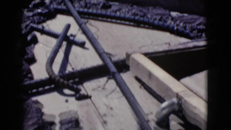 Close view of lumber, rebar, and construction materials at an outdoor work site in Cottonwood, Arizona, in 1968.