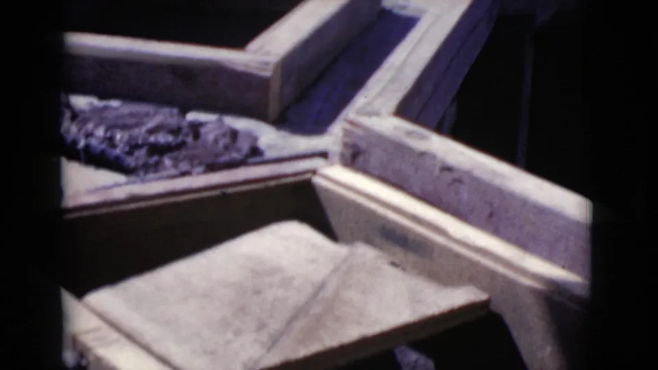 Wooden formwork, rebar, and flat construction material appear in the 1968 Cottonwood well-building scene.