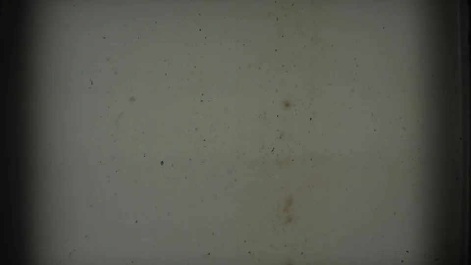 Blank 8mm reel frame from the 1968 San Diego County home movie, showing dust, scratches, soft exposure, and darkened frame edges.