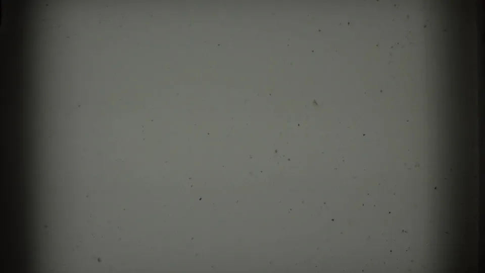 Leader-like 8mm frame from the 1968 reel, with muted exposure, visible dust, fine scratches, and heavy vignette along the edges.