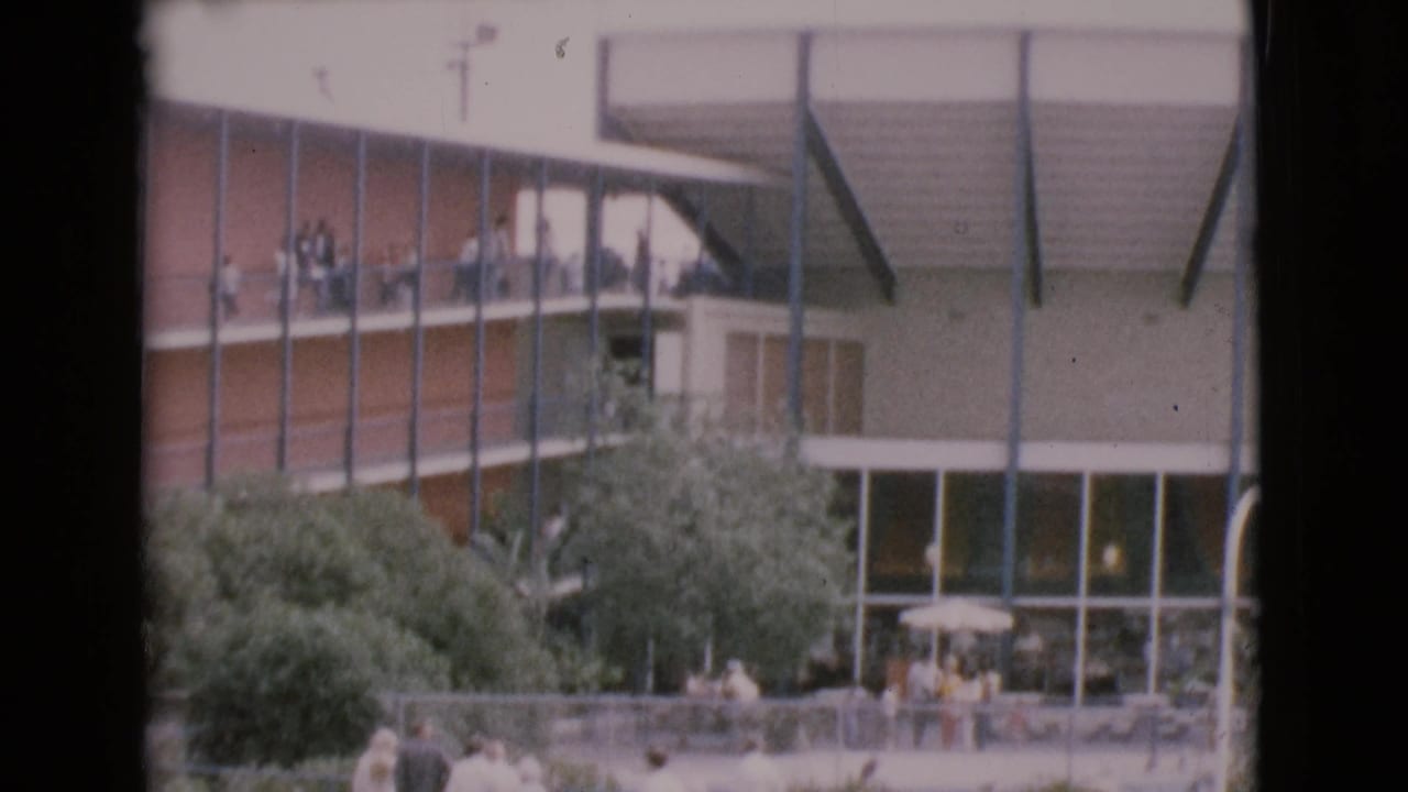1968 San Diego County attraction view with MarineLand visitors on upper decks and people gathered below near windows and trees.