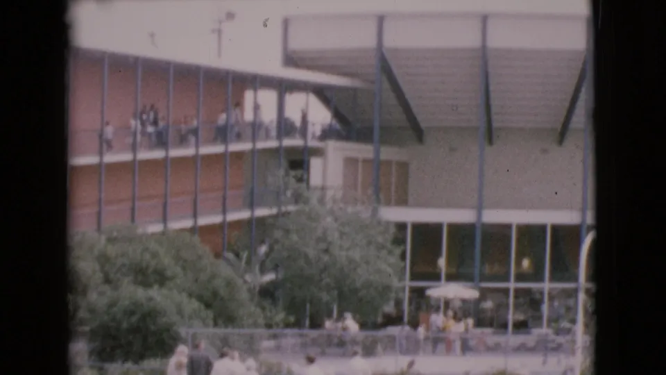 1968 San Diego County attraction view with MarineLand visitors on upper decks and people gathered below near windows and trees.