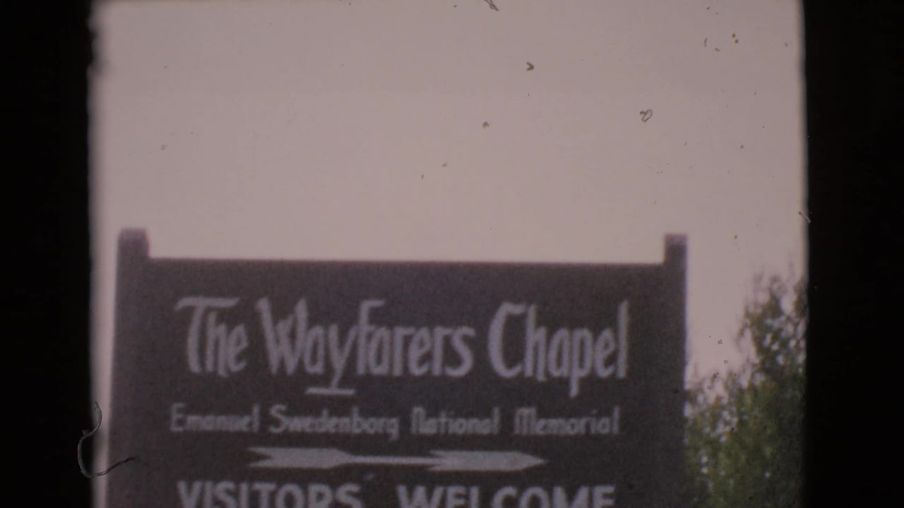 Roadside sign for The Wayfarers Chapel partly framed by 8mm film borders.