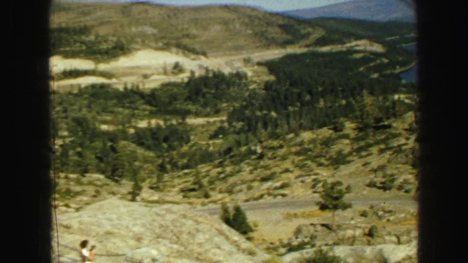 A final 1968 Vancouver-area landscape view shows rocky hills, scattered pines, a lower road, and a partial lake view.