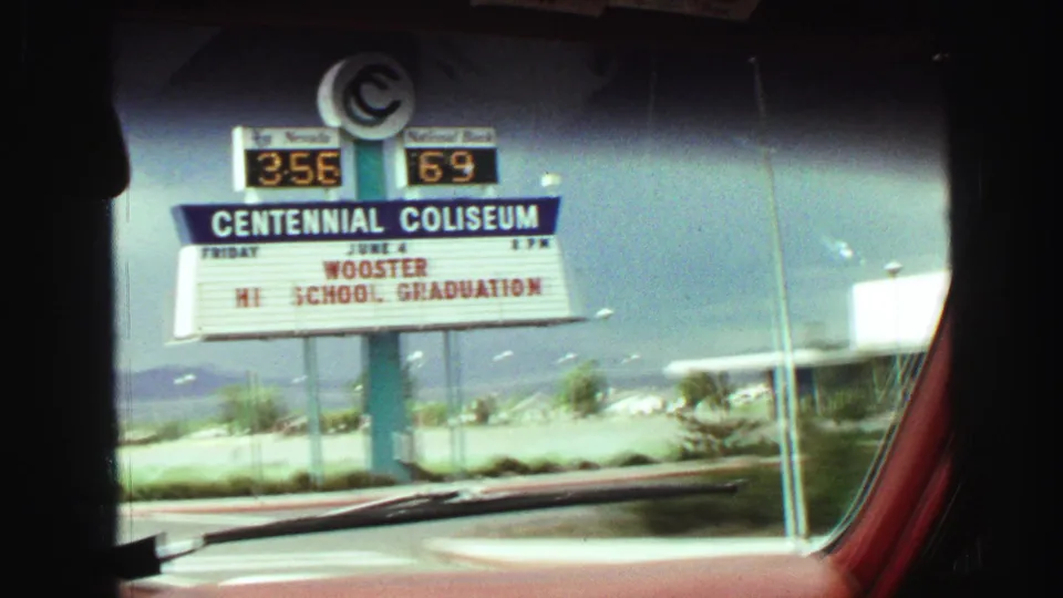 Close 1968 home-movie view of the Centennial Coliseum marquee with Wooster High School Graduation text visible.