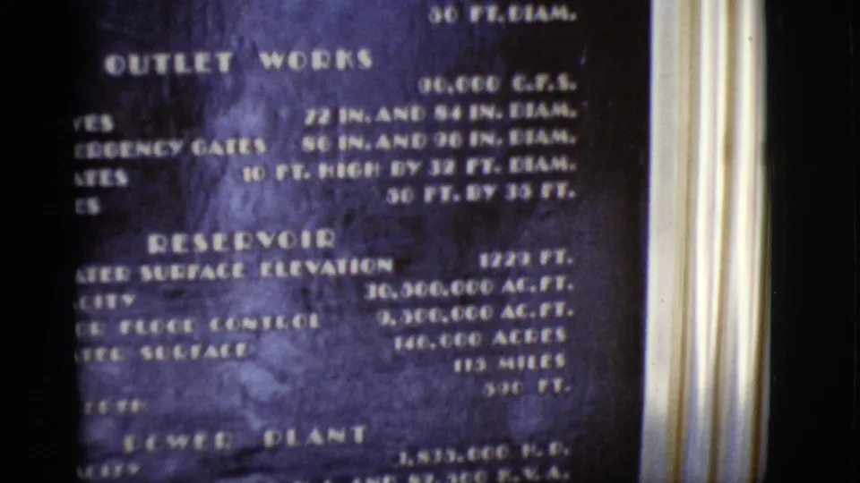 1968 Arizona 8mm frame showing the lower part of the dam board, with reservoir details above a power plant heading.