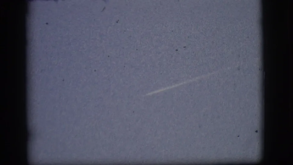 The final 1968 Flagstaff frame shows the contrail in the lower right, with dark film edges and light surface specks.