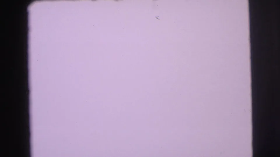 Pale lavender overexposed 8mm frame at the end of the Yellowstone clip, bordered by dark gate edges and light surface marks.