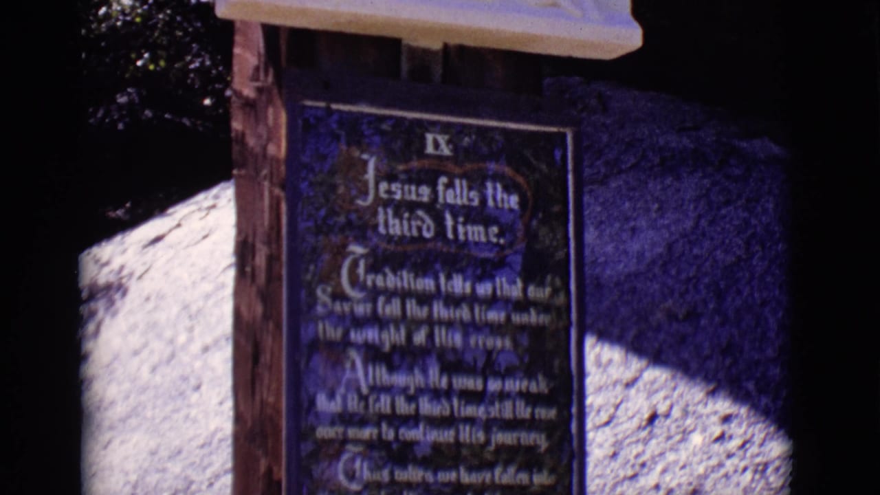 Ninth Station plaque partially framed by a pale relief above it.