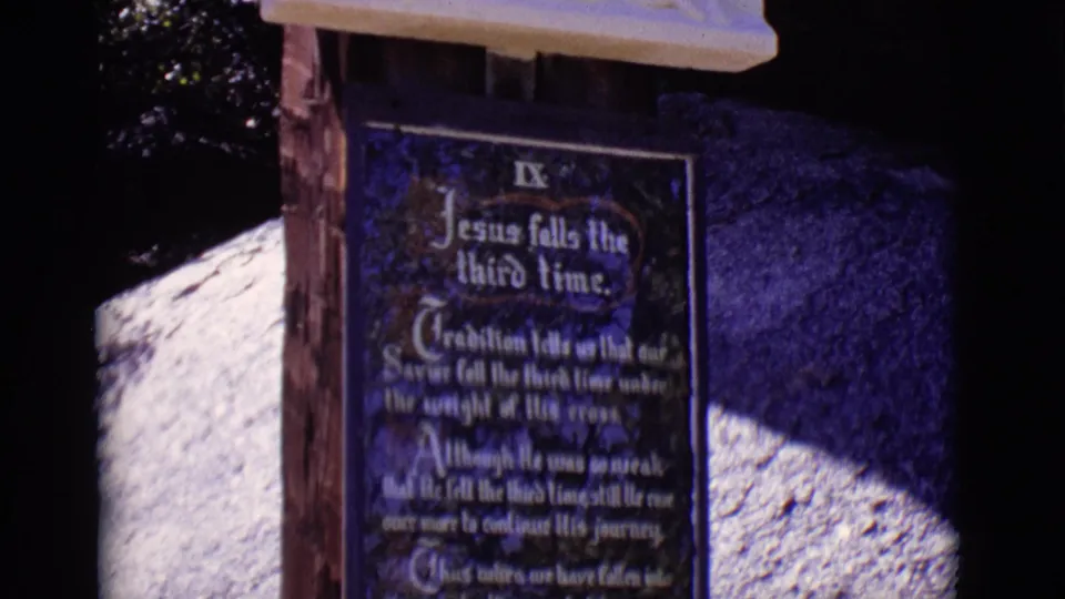 The San Luis, Colorado station marker fills the frame, with the Ninth Station plaque below a pale carved relief edge and strong sunlight on stone.