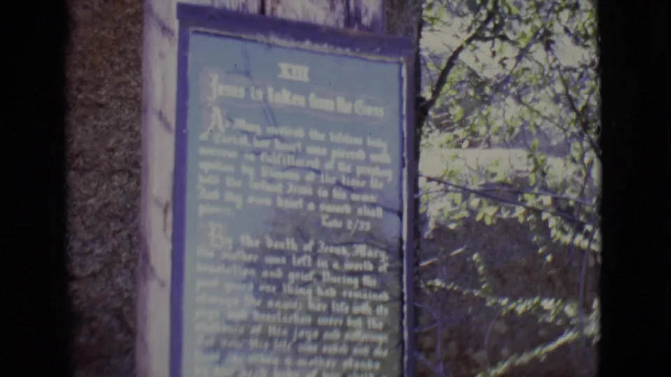 1965 San Luis, Colorado frame of the blue thirteenth station plaque, partly softened by handheld focus and exposure.