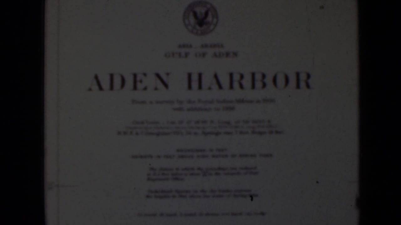 White title card reading ADEN HARBOR with smaller text and a crest at the top.