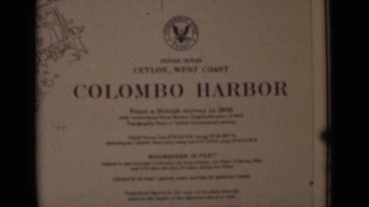 A printed title card reads Colombo Harbor and references Ceylon West Coast, with an emblem near the top and chart markings at the edge.