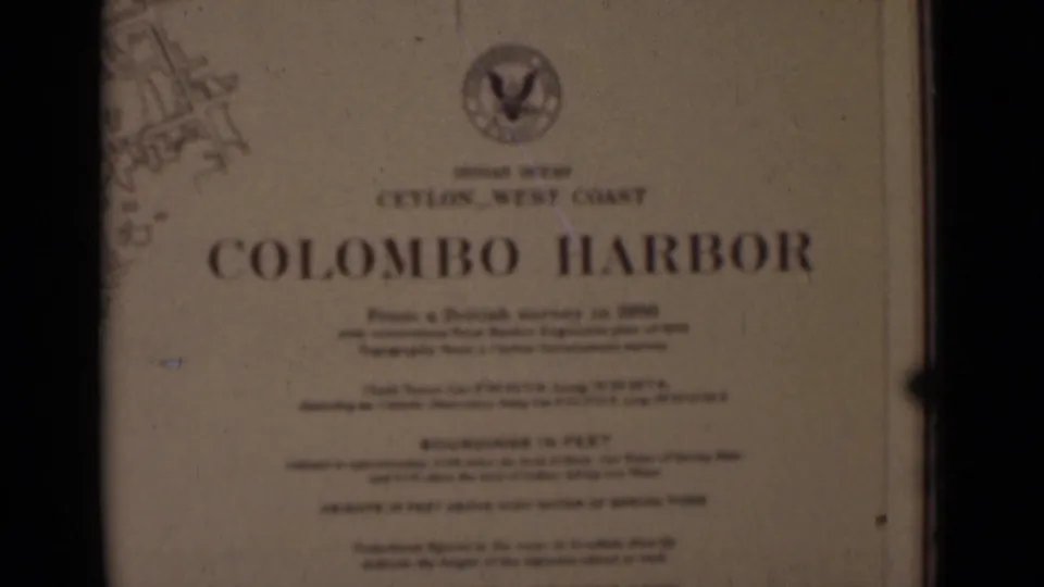 A printed title card reads Colombo Harbor and references Ceylon West Coast, with an emblem near the top and chart markings at the edge.