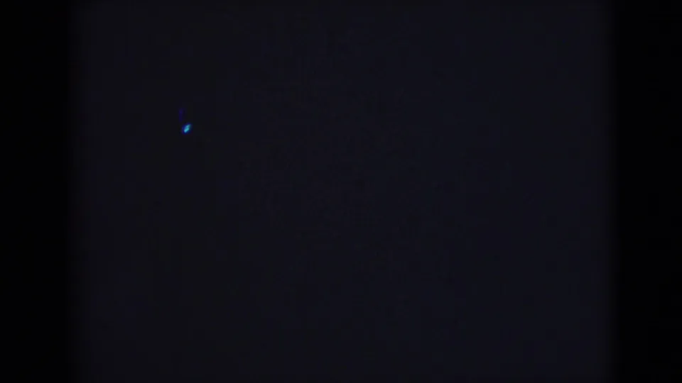 Dark end frame from the 1946 India 8mm clip, with the maritime scene no longer clearly visible.