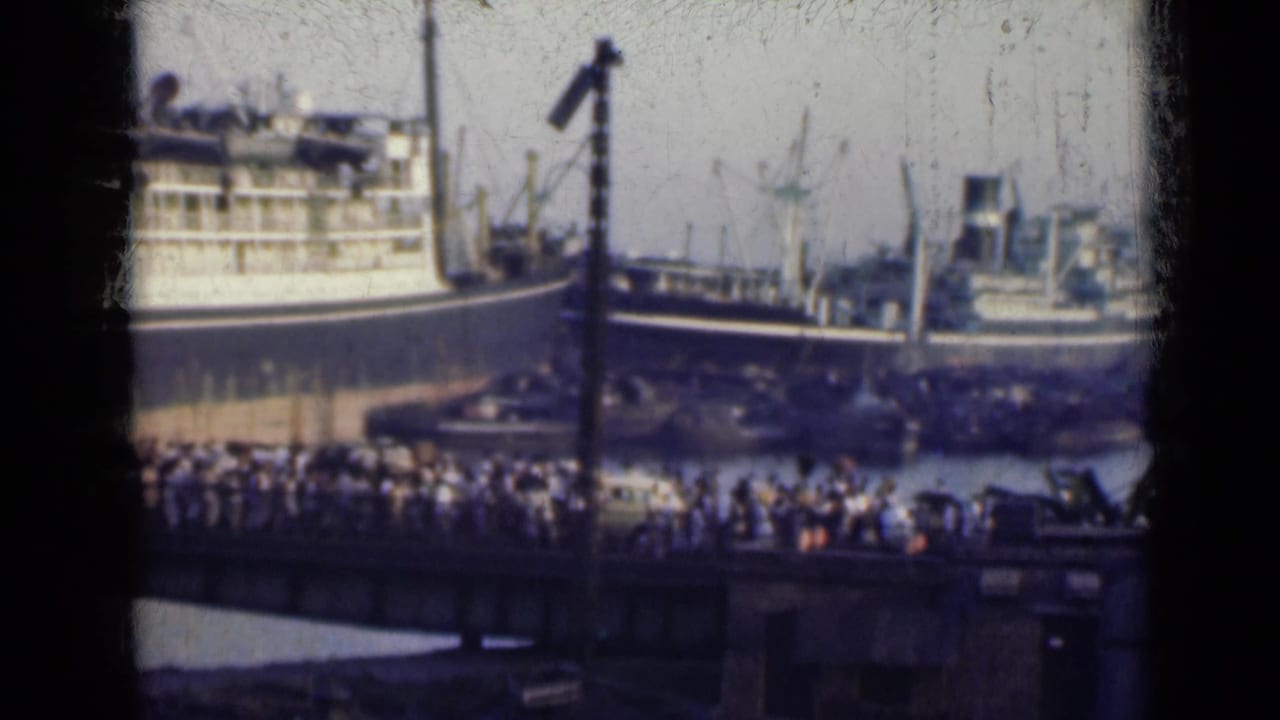 A second 1947 India harbor view shows passengers or onlookers along the waterfront with ships and cranes behind them.