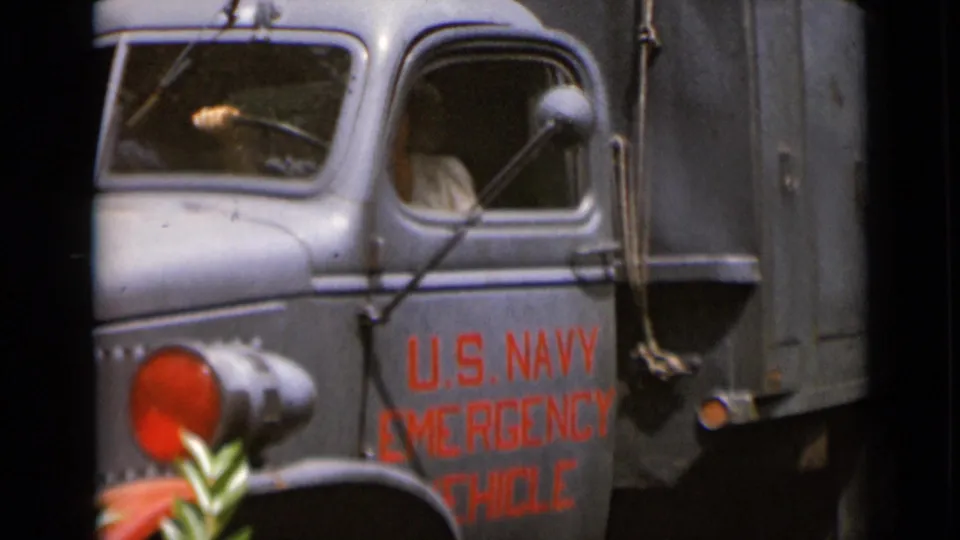 A close home-movie view shows the truck cab and door lettering as the person shifts inside the driver's area.