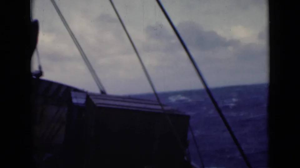 Deck view with rigging lines, a dark cabin-like structure, and rough sea beyond, reportedly from Persian Gulf footage.