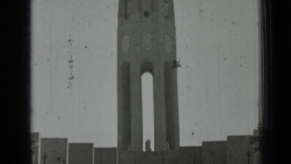 A tall church tower and surrounding stepped walls are visible in the final 1937 San Francisco home-movie frame.