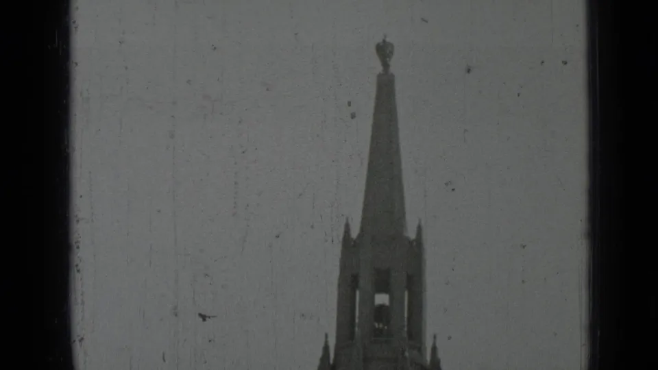 1937 San Francisco 8mm view of the cathedral spire and finial above the bell tower, with grain and scratches visible.
