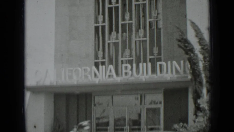 Closer 1937 San Francisco view of the California Building sign and entrance details with a partially visible pedestrian below.