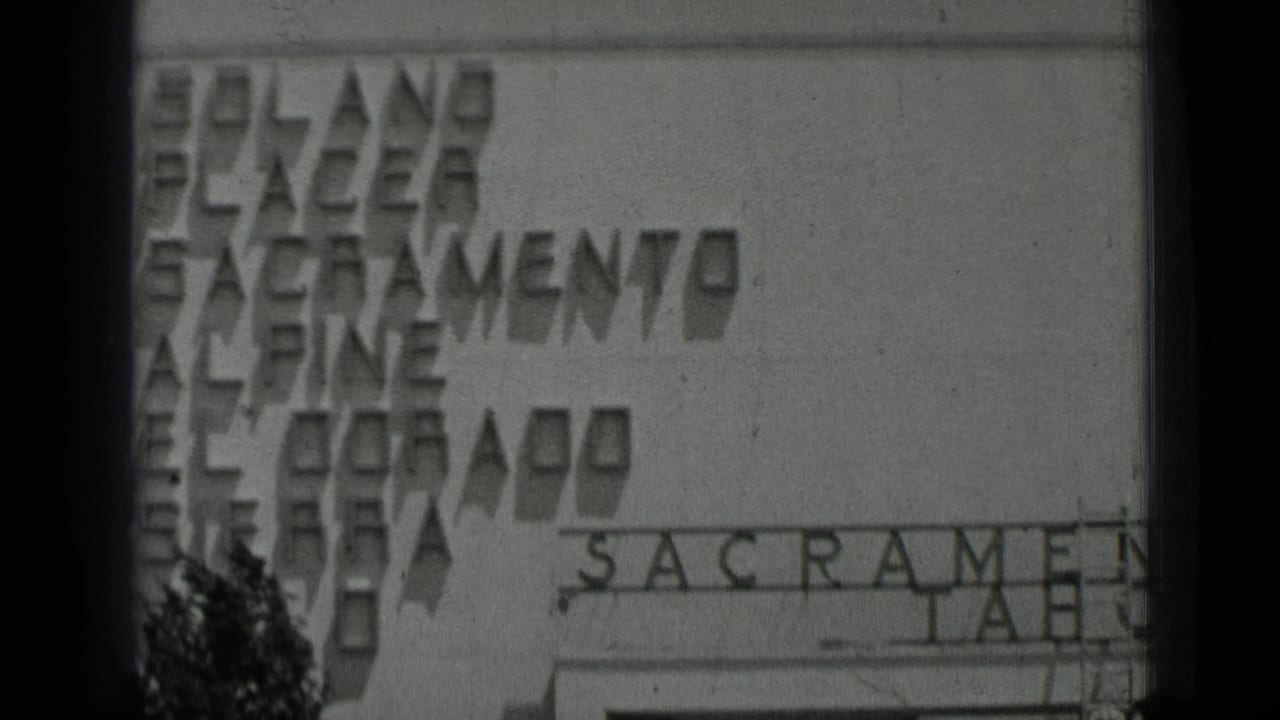 Building facade with partial Sacramento and Tahoe lettering visible through dark film gate edges.