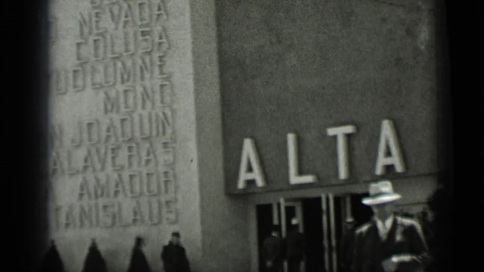 1937 San Francisco street frame showing bold ALTA lettering above an entrance as a suited man in a light fedora passes by.