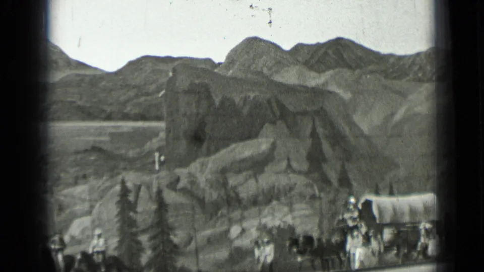 The frame shows a wide visitor-shot view of staged mountain scenery, wagons, and costumed people in San Francisco, 1937.