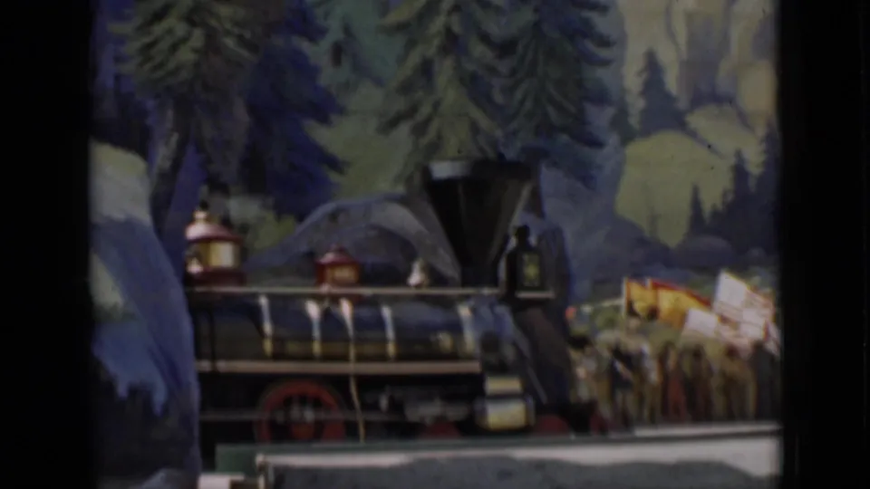 A small steam locomotive display appears beside parade participants and flags in the 1937 San Francisco footage.