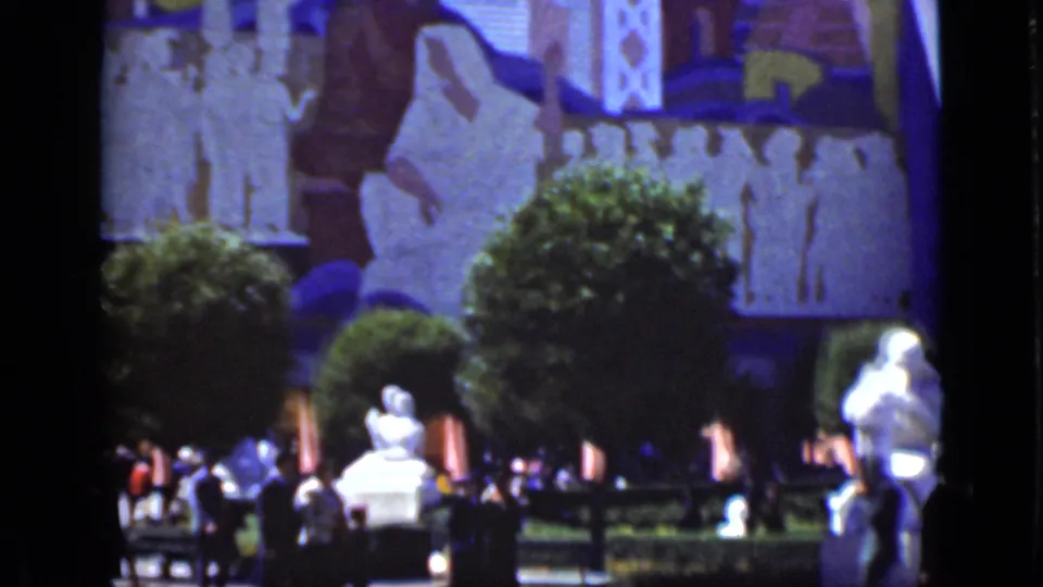 A 1937 San Francisco garden view shows visitors near hedges, white statuary, rounded trees, and an indistinct mural or bas-relief.