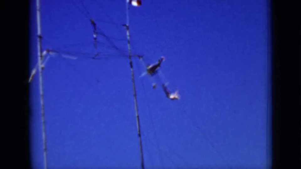 1937 San Francisco frame showing the suspended airplane mobile shifted to the right of the pole amid fine overhead wires.