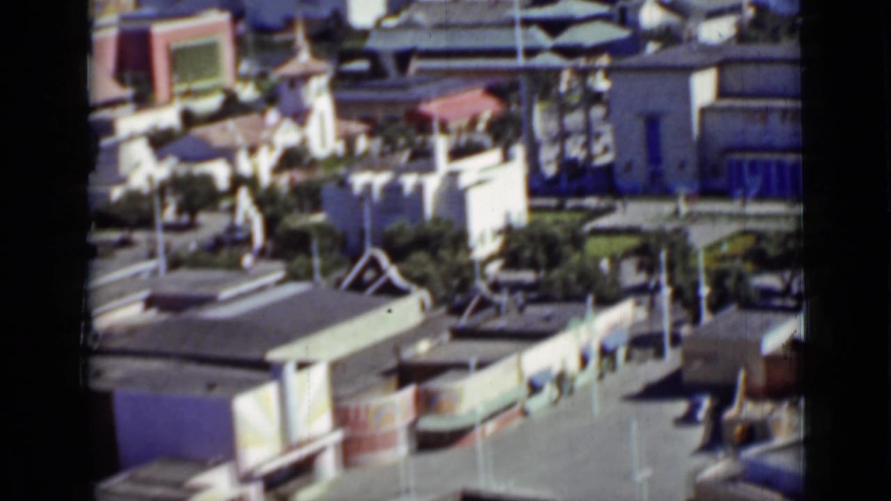 Elevated San Francisco view of light-colored buildings, paths, and open grounds in 1937 home-movie footage.