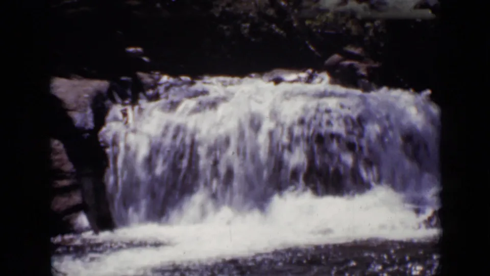 The final frame concentrates on the waterfall itself, with white water dropping over dark rock in the Colorado outdoor setting.