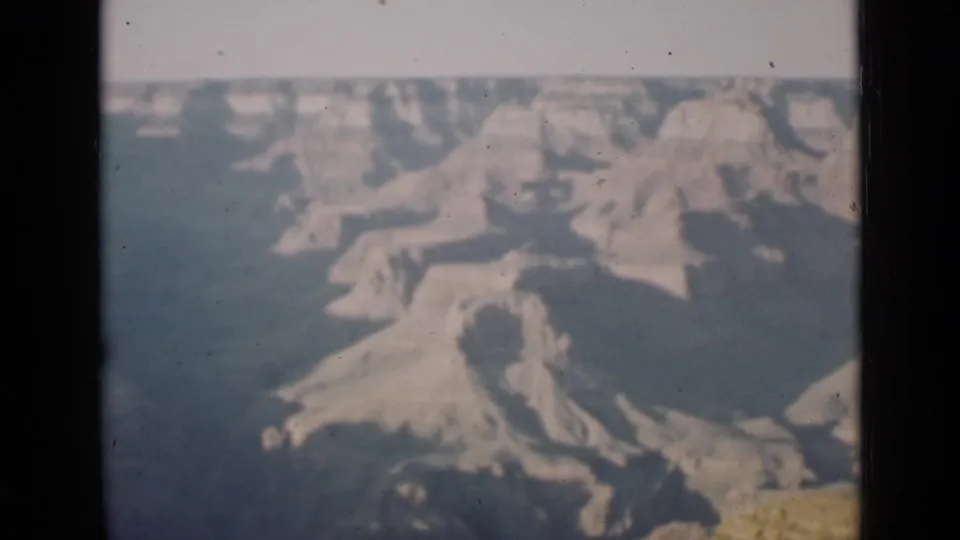1939 Arizona home-movie view of Grand Canyon cliffs, with soft focus, muted color, and visible film grain.