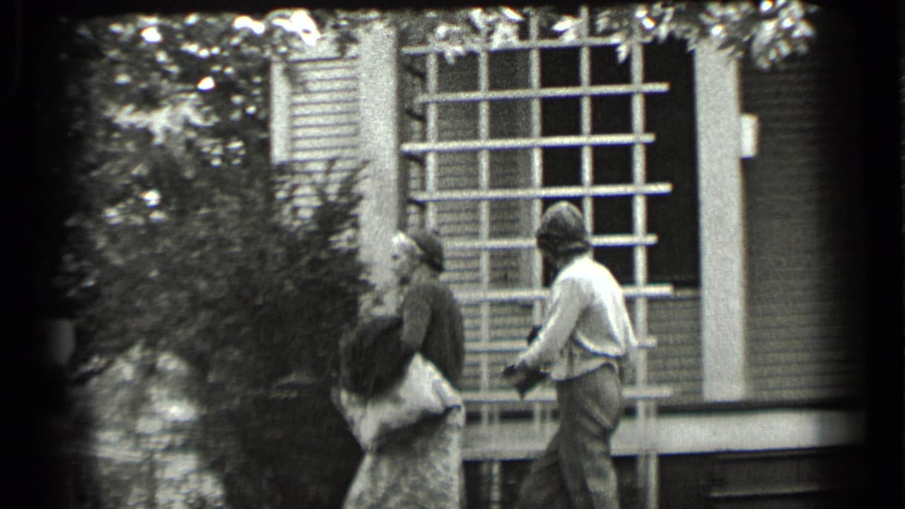 The women step from the porch area toward shrubs and trees, continuing the brief domestic exchange in Clear Lake home-movie footage.