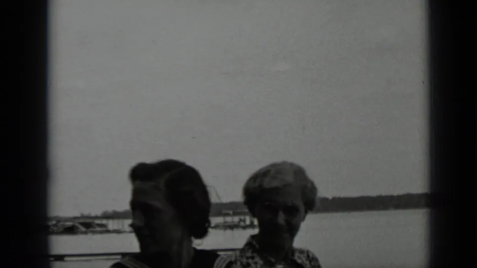 Two women at Clear Lake, California, face partly toward the camera in black-and-white 1939 8mm home-movie footage.