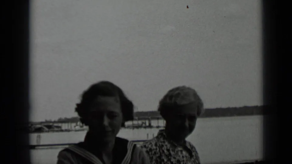 The two women remain framed against Clear Lake, their faces darkened by backlighting in the 1939 home-movie shot.