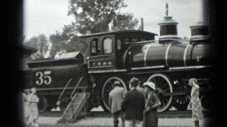 1939 New York home-movie view of the Number 35 tender, steam locomotive, and visitors gathered on the platform.